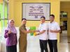Penyerahan secara simbolis Program BPJS Ketenagakerjaan. (Dok. Istimewa) 